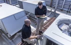 Stanley Steemer technicians work on commercial roof