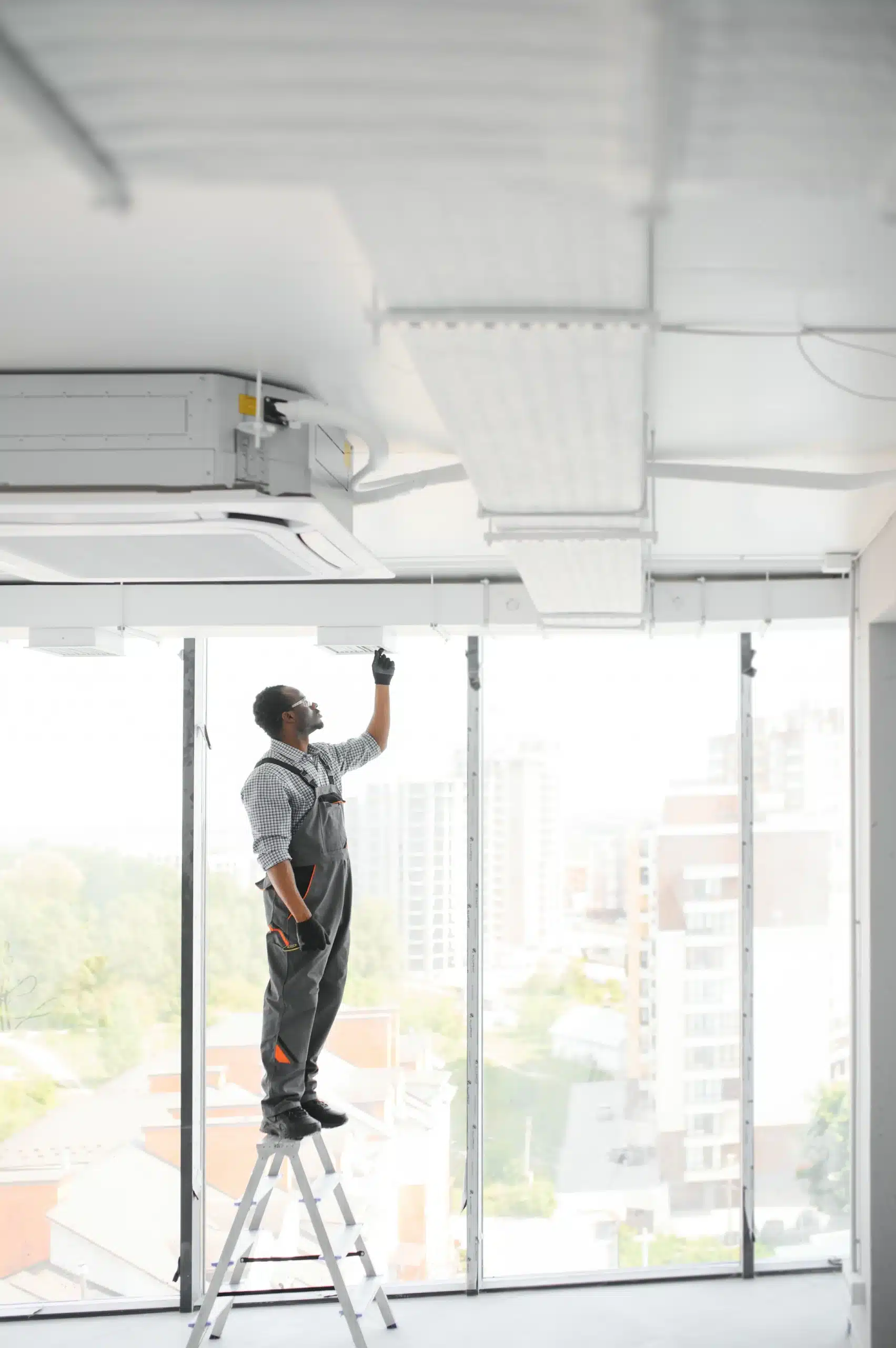 Modern circular HVAC air vent in a South Florida commercial office for improved workplace productivity